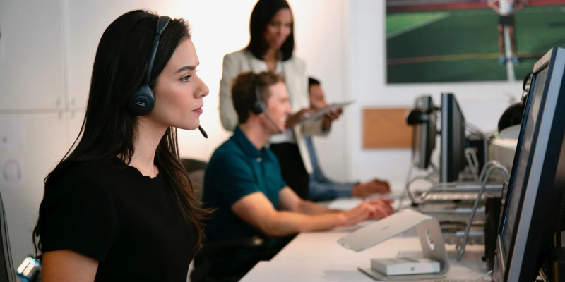 3 call centre Colleagues reviewing customer profile